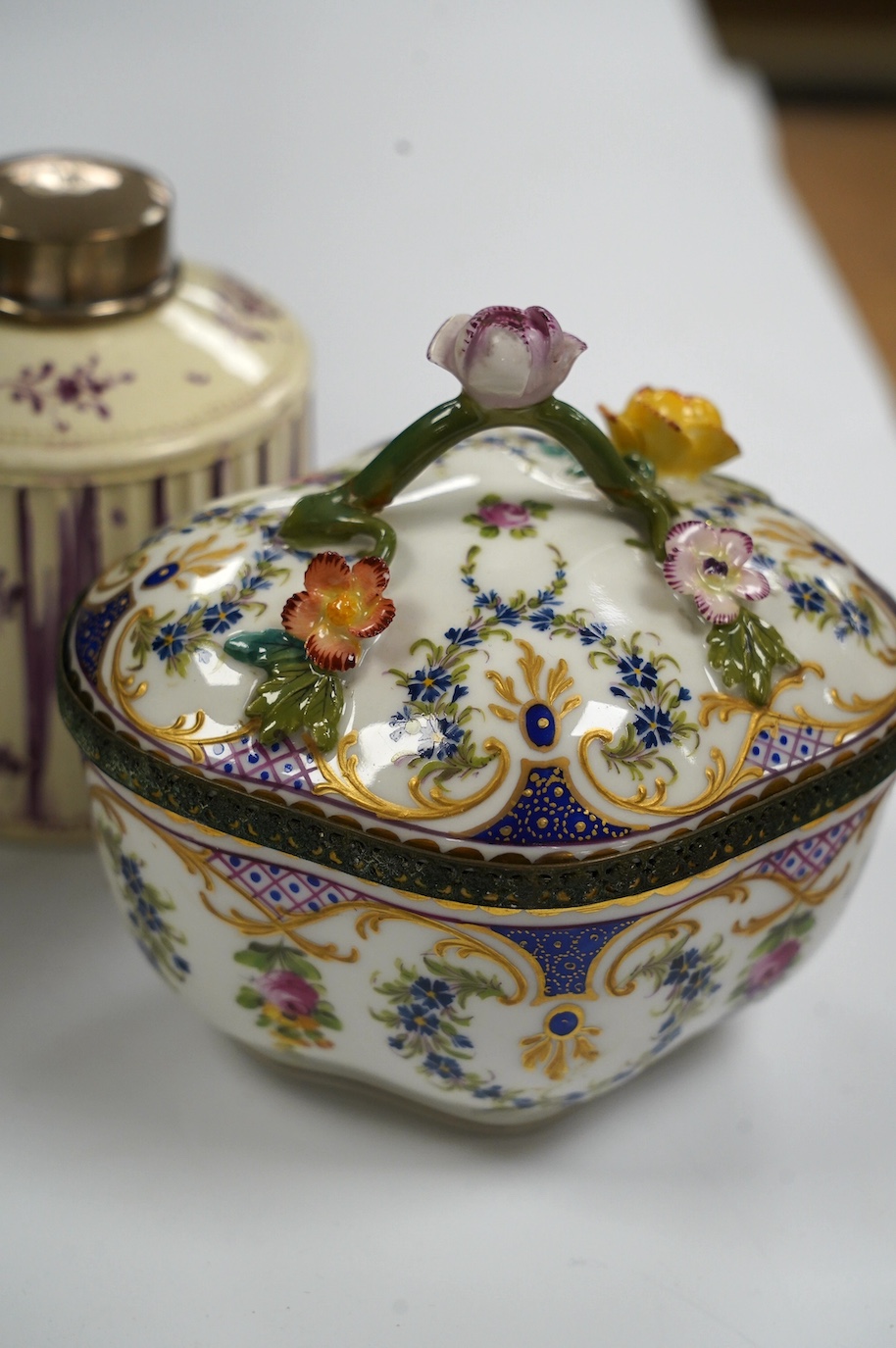 A Dresden porcelain ink stand, 11cm high, and an 18th century English creamware tea caddy with a silver lid, 10cm high. Condition - fair to good